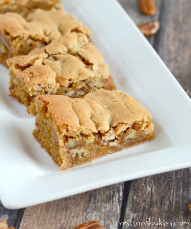 chewy butterscotch bars on a white tray