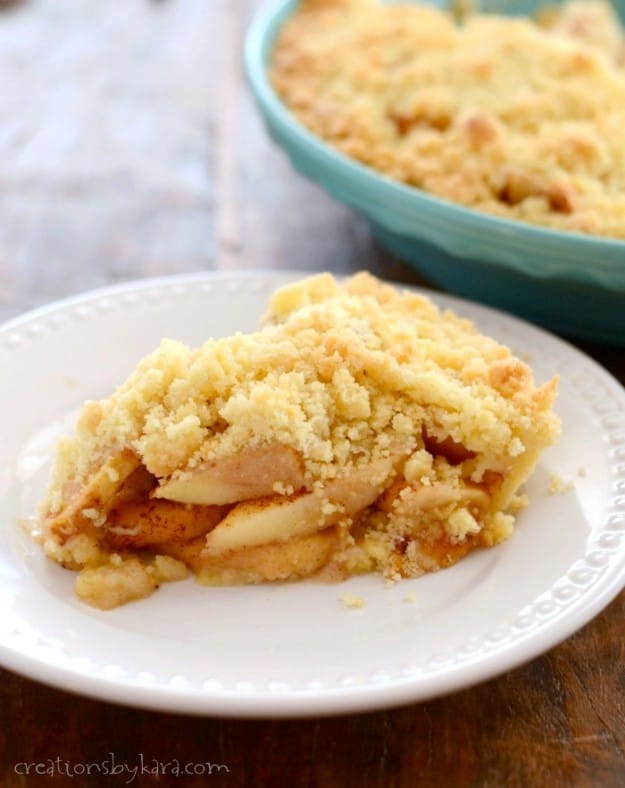 slice of apple pie with crumb topping