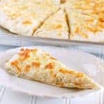 This Focaccia Cheesy Bread is so easy to make, but tastes out of this world. Everyone raves about it, and my kids can make it!