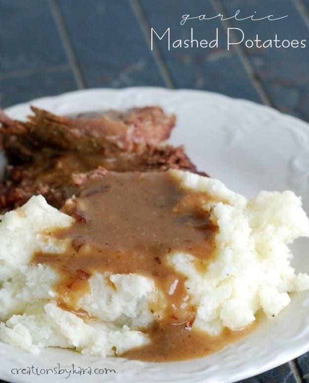 mashed potatoes with beef gravy on a white plate