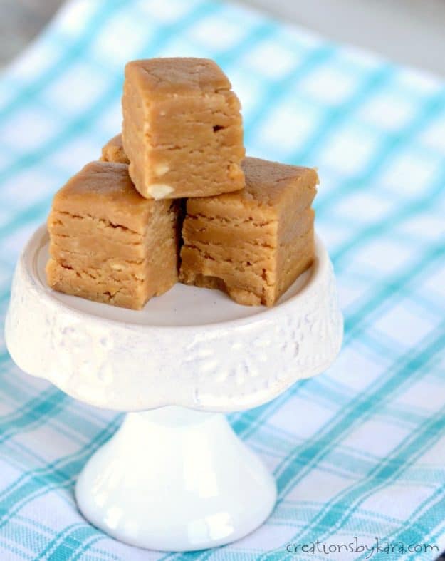 squares of peanut butter fudge on a cupcake stand