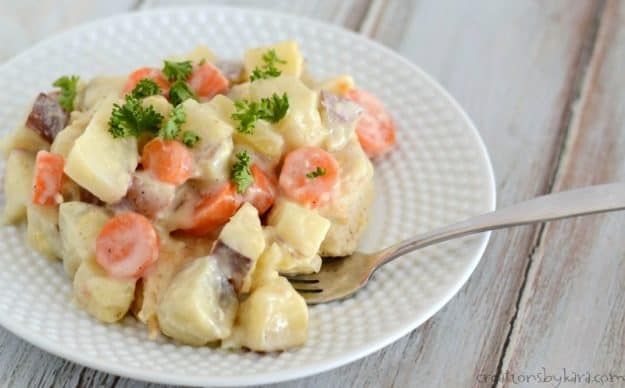 Chicken, potatoes, and carrots in a creamy sauce. Everyone loves this Dutch oven chicken. And you bake it in the oven!