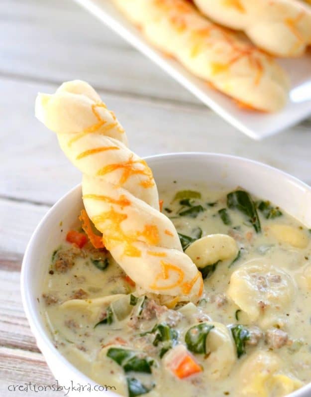Garlic Cheddar Breadstick dipped in soup. 