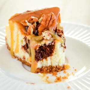 caramel turtle cheesecake on a plate