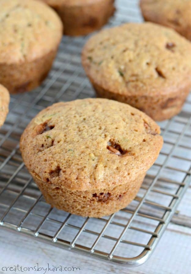 cinnamon chip zucchini muffins on a cooling rack