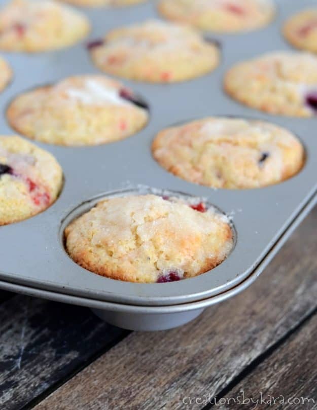 blueberry cherry muffins in a muffin pan