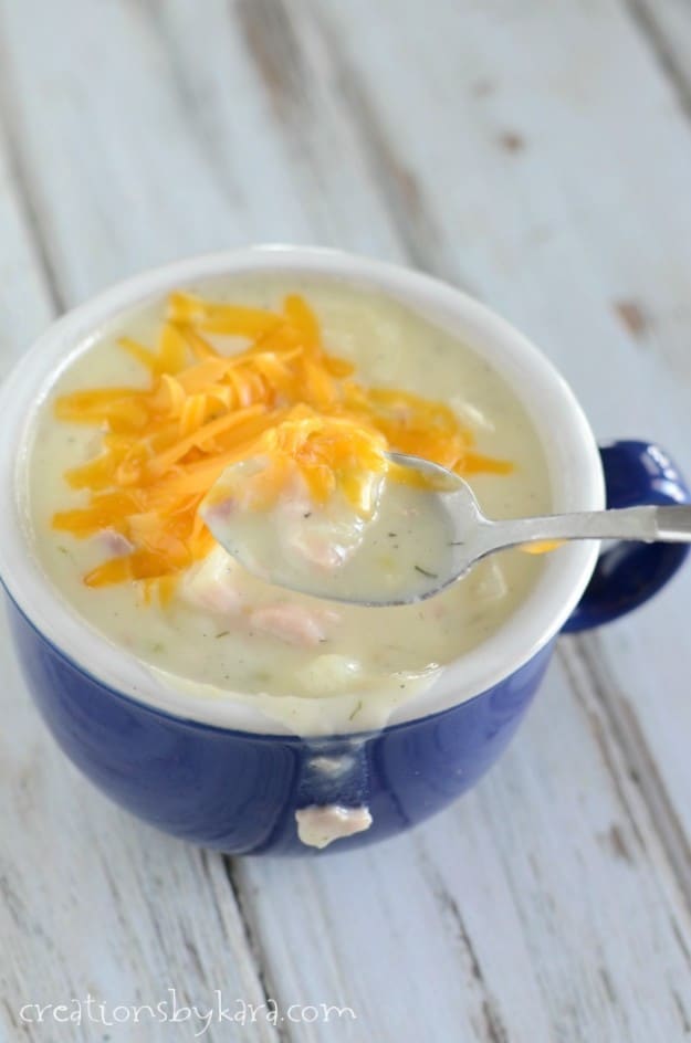 spoonful of potato chowder with ham and cheese