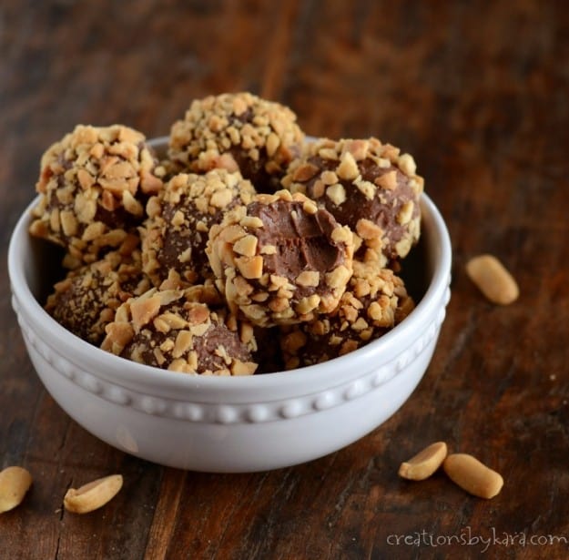 bowl of chocolate peanut butter truffles with peanuts