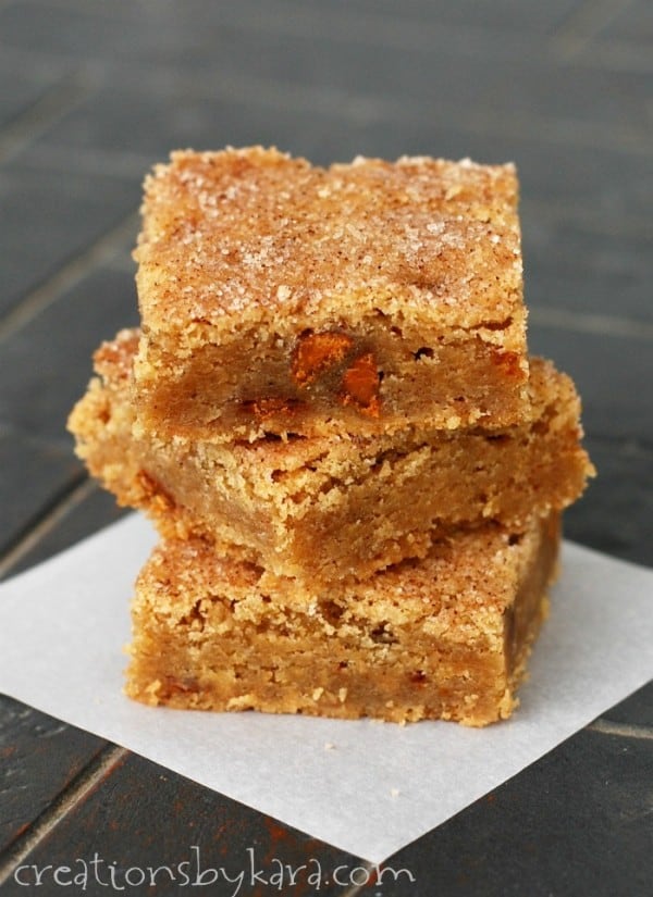 stack of snickerdoodle blondies on waxed paper