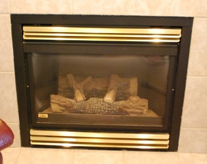 How to make over a brass fireplace using black spray paint. A fast and easy DIY project!