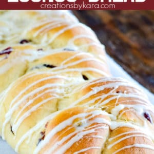loaf of braided cranberry eggnog bread with glaze