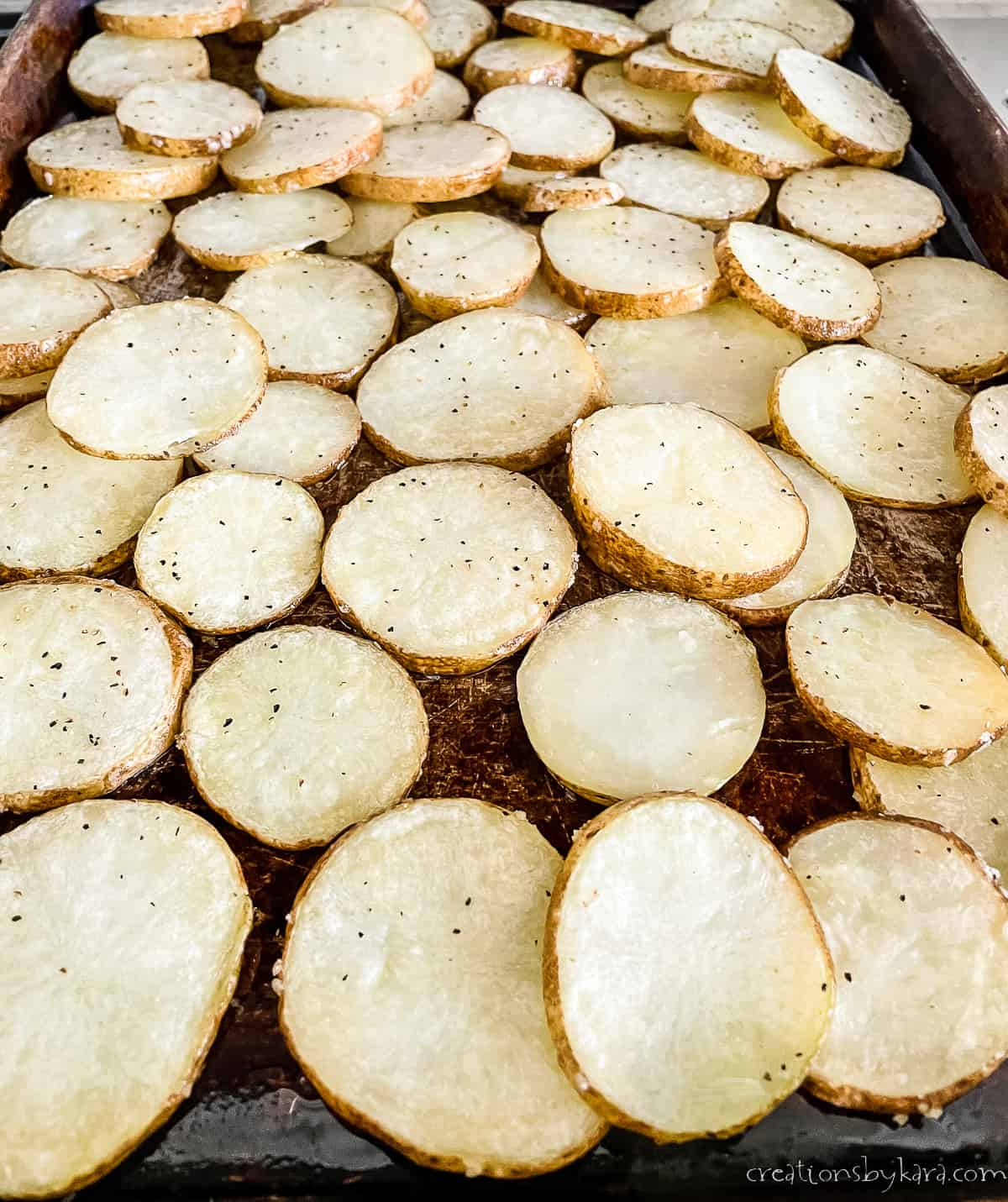 potatoes being roasted in the oven