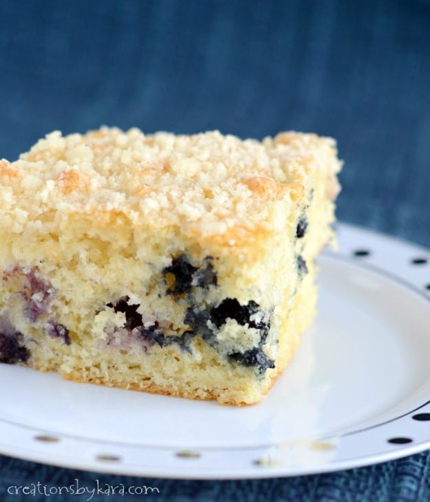 close up of blueberry coffee cake with buttery crumb topping