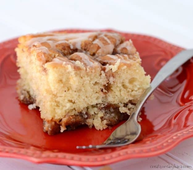 Pockets of cinnamon sugar and a vanilla glaze make this Cinnamon Roll Cake the perfect comfort food. Everyone loves this cake!