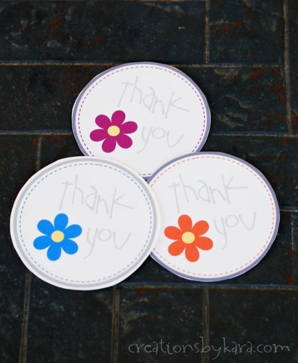 overhead shot of circle flower thank you tags