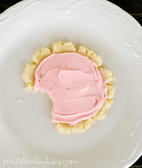 roll and press sugar cookie with pink frosting