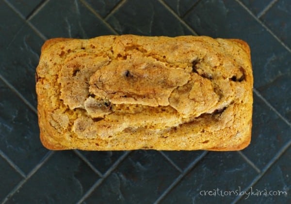 loaf of pumpkin bread sprinkled with cinnamon sugar