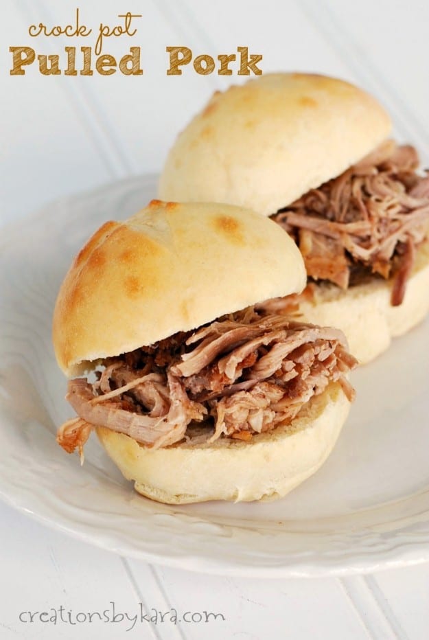 plate with two pulled pork sandwiches