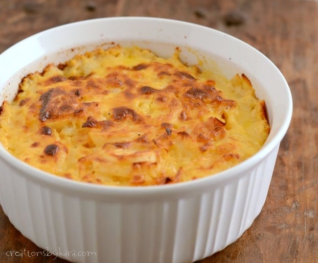 Au Gratin Potatoes- Layers of tender potatoes surrounded with creamy cheddar cheese sauce.