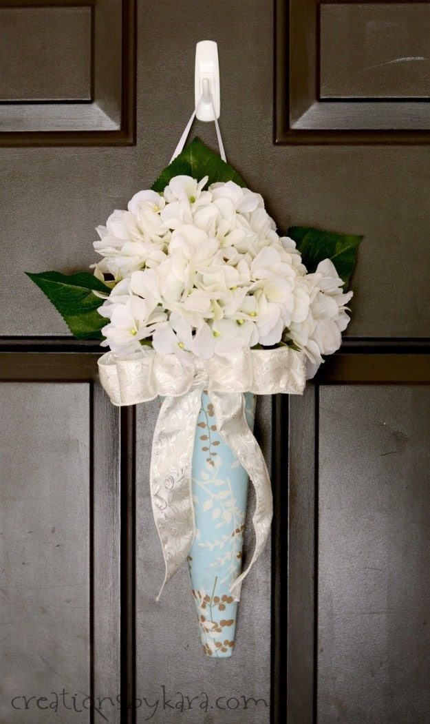 You will be surprised at how easy it is to make this lovely hanging flower arrangement!