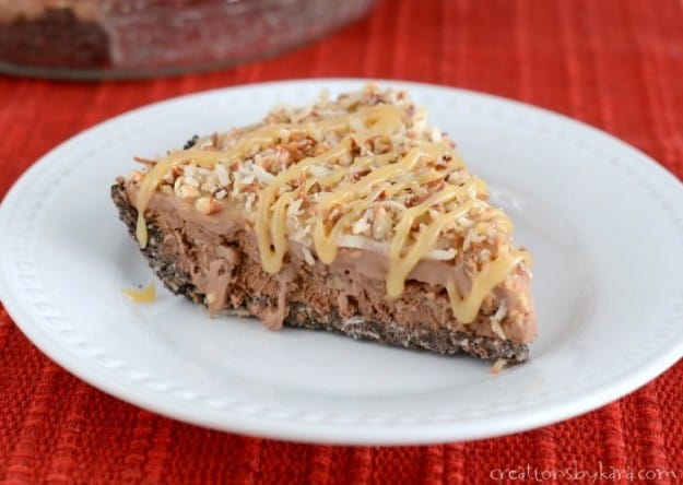 slice of frozen chocolate pie with coconut, pecans, and caramel