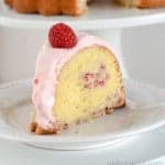 White Chocolate Bundt Cake with Raspberry Swirl, topped with raspberry cream cheese frosting.