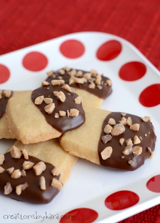 plate of brown sugar shortbread cookies dipped in chocolate