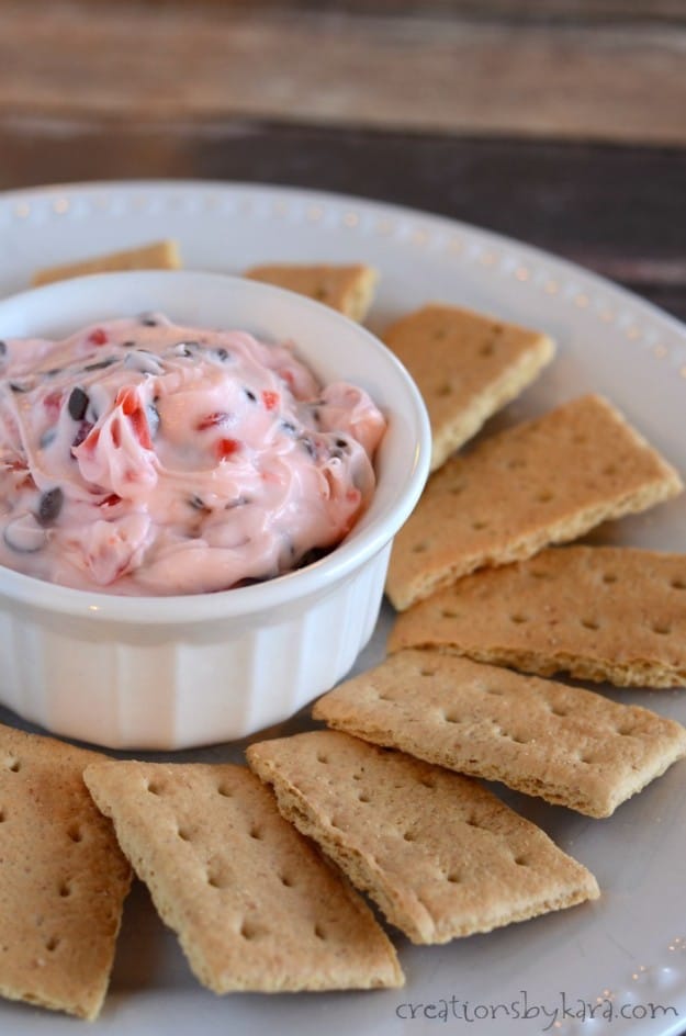 bowl of cherry chocolate chip dip with graham crackers
