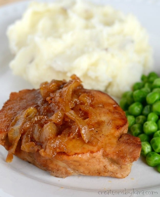 plate with pork chop, mashed potatoes, and peas