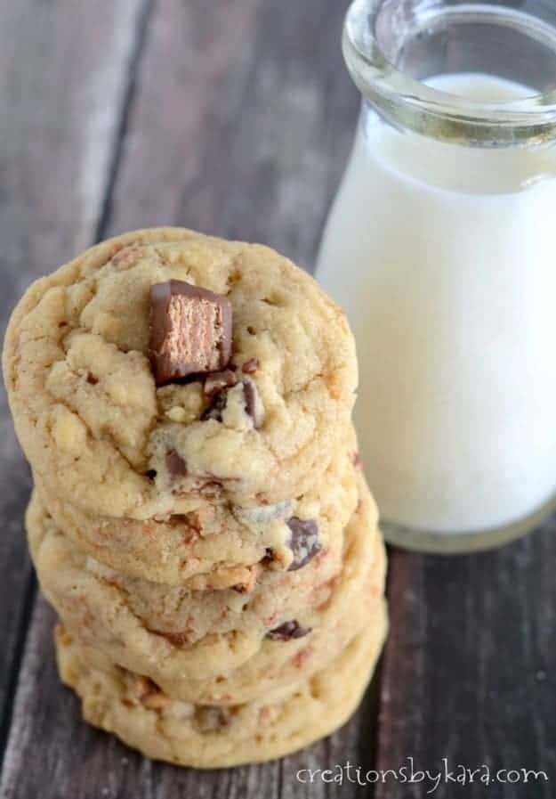 overhead shot of stack of cookies with kit kats and a glass of milk