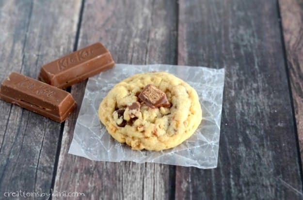 cookie on waxed paper with kit kat candy bars