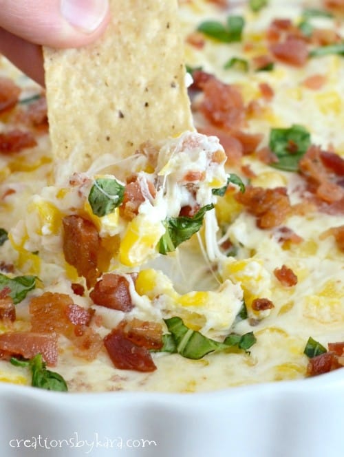 This creamy Cheesy Corn Dip is loaded with crispy bacon, sweet corn, and cream cheese. Such a yummy appetizer!