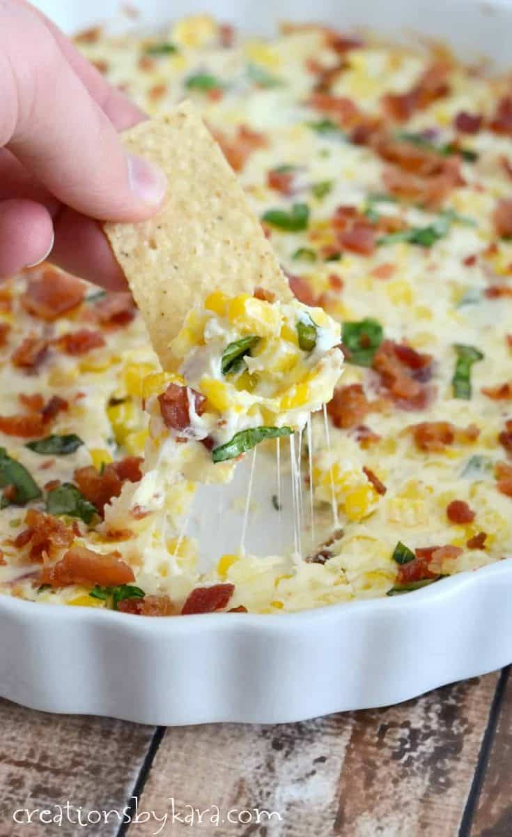 Loaded with crispy bacon, sweet corn, and cheese, this Cheesy Corn Dip is sure to become a favorite appetizer!