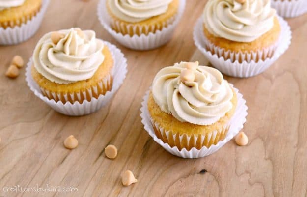 butterscotch cupcakes on a wood cutting board