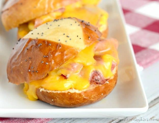 sliders with melted cheese, eggs, and ham