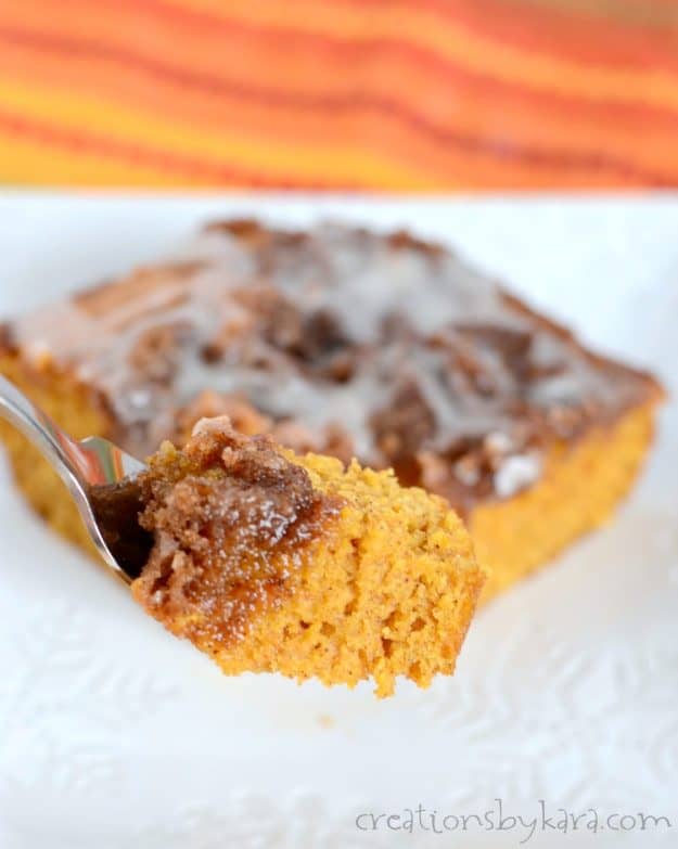 close up of pumpkin cinnamon roll cake on a fork