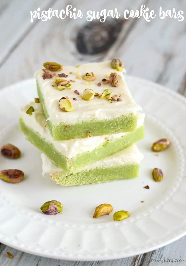 stack of pistachio sugar cookie bars on a plate