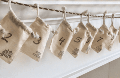 farmhouse style advent calendar bags hanging on twine