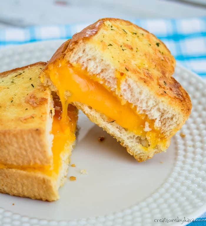 cheese sandwich made with garlic butter cut in half