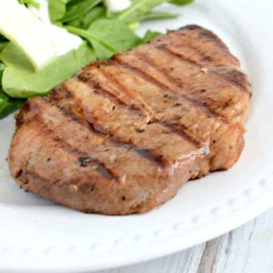 This simple marinade makes the tastiest grilled pork chops. My whole family raves about them!