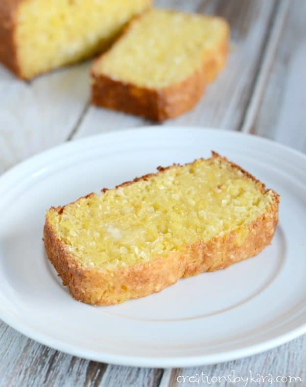 warm pineapple coconut bread with melted butter on a plate 