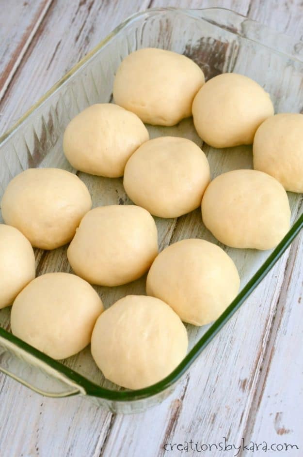 raised rolls in a baking dish