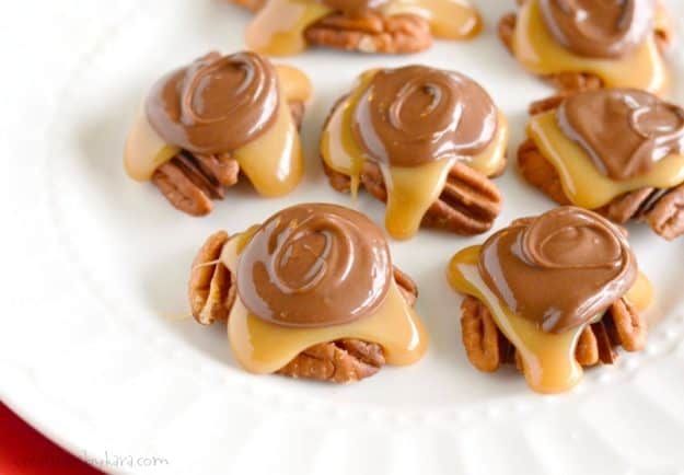 pecan turtle candies on a white plate
