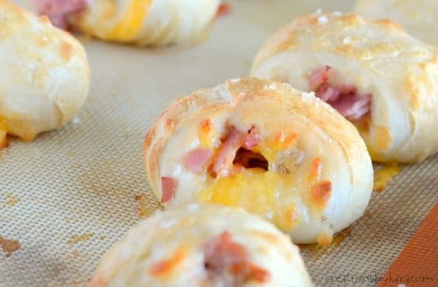 Hot pretzel bites stuffed with ham and cheese.