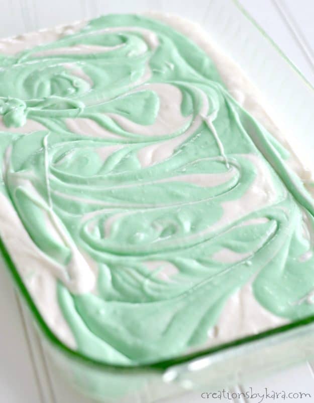 pan of white and green swirled cake batter