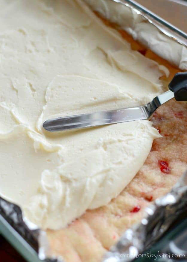 Cream Cheese Frosting makes these Cherry Sugar Cookie Bars melt in your mouth delicious! #cherries 