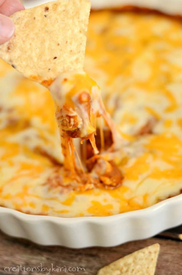 chili dip with strings of melted cheese
