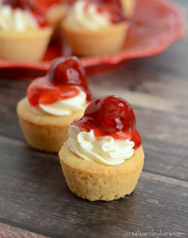 Bite sized cherry cheesecakes in cookie cups