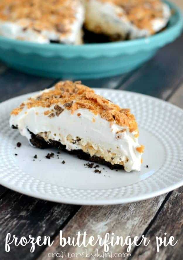 A slice of frozen Butterfinger Pie with a whole pie in the background