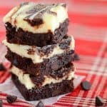 Photo of stacked cheesecake brownies